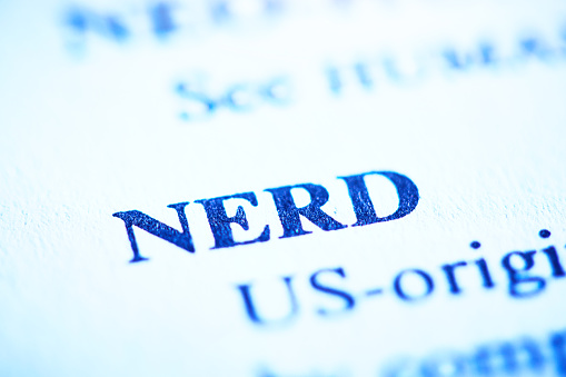 Close-up of the bold term NERD in tight close-up shot of an entry in a business dictionary.