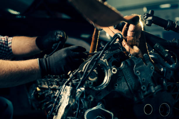 istock Auto mechanic working in garage. Repair service. 1391212448