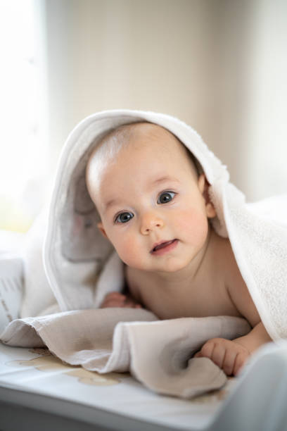 istock Baby wearing towel after bath 1391212540