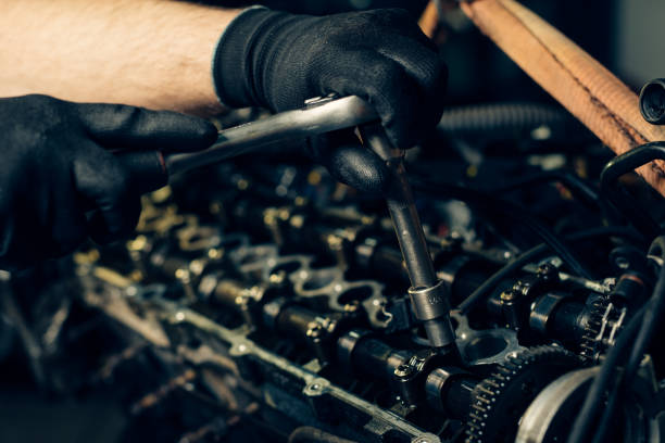 istock Auto mechanic working and repair on car engine in mechanics garage 1391212596