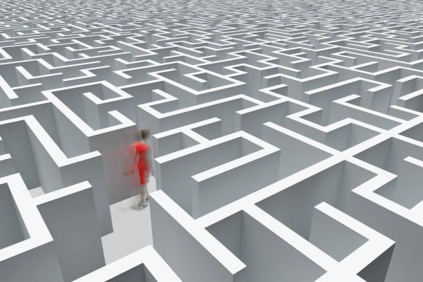 istock Business woman in a complex maze 1391214485