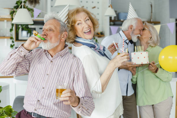 istock Cheerful senior group having great time on a birthday party 1391214672