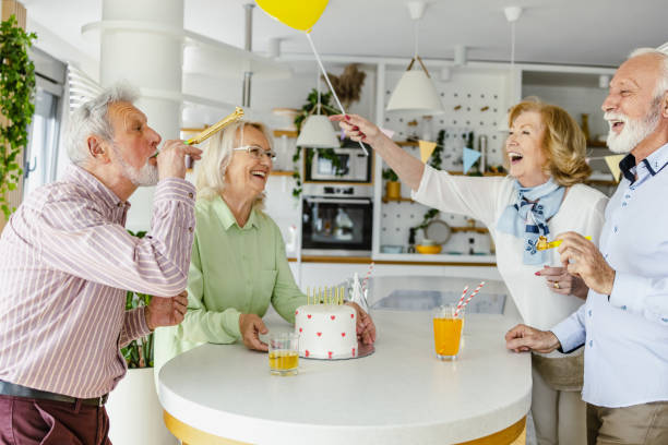 istock Senior group dancing and singing on a birthday party 1391214950