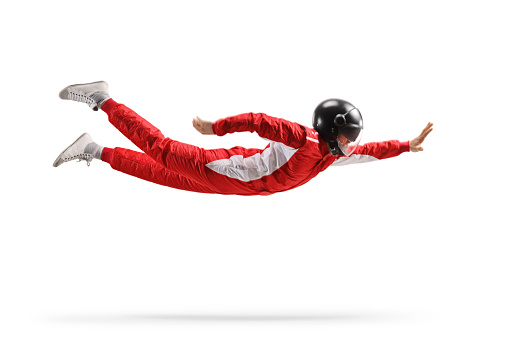 Car racer in a red suit flying isolated on white background