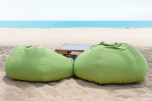 Outdoor seating set on a beautiful sandy beach near Tangalle, Sri Lanka