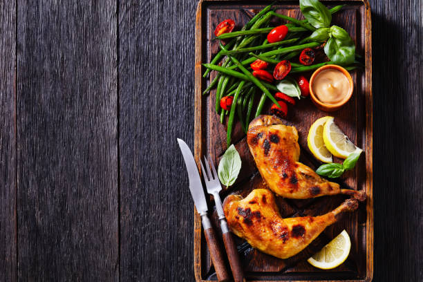 istock roast chicken legs with green beans, tomatoes 1391218515