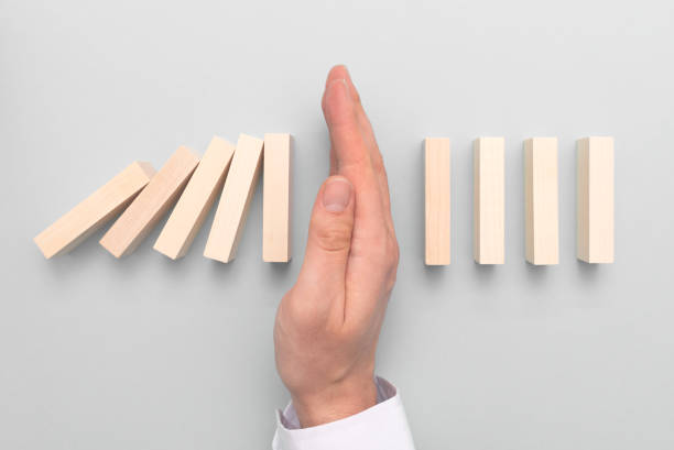 istock Domino business risk, crisis effect concept 1391218748