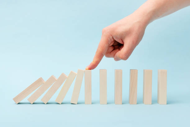 istock Domino business risk, crisis effect concept 1391218755