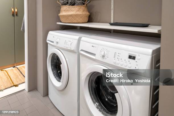 White Laundry Machine Installed In The Bathroom Stock Photo - Download Image Now - Washing Machine, Dryer, Installing