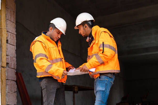 istock Two engineers having business meeting at construction site 1391219044