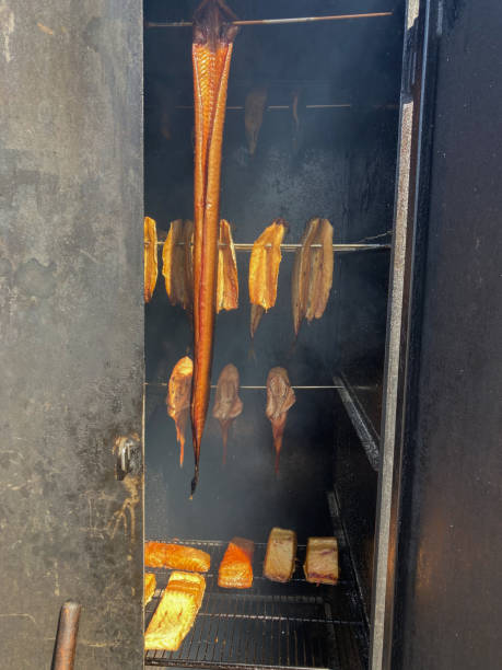 istock The process of smoking fish - a smokehouse filled with fish 1391220309