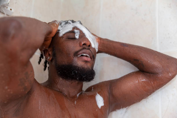 istock Portrait of man used shampoo while taking shower 1391221681