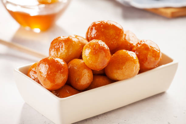 Homemade Greek Loukoumades Dough Balls With Honey stock photo