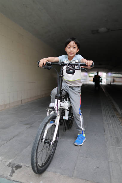 Chinese boy riding a bike