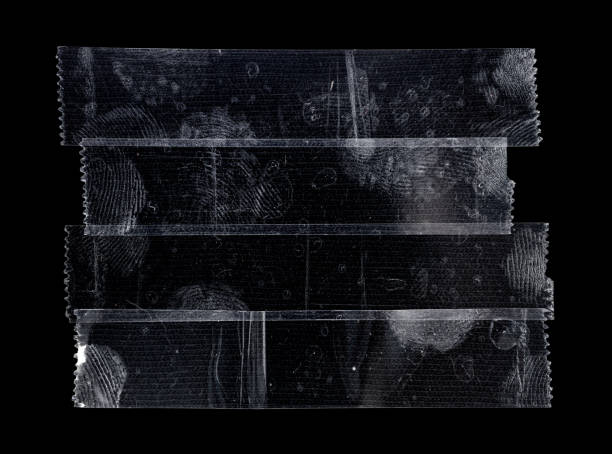 istock four transparent sticker tapes overlapping each other on black background. 1391223500