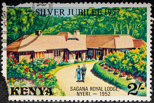 Kenya - circa 1977: A Kenyan postage stamp depicts Elizabeth II and Prince Philip at Sagana Lodge.