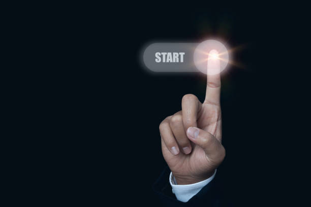 Businessman hand push start button on virtual screen in the slide bar to unlocks. Concept of system start working.