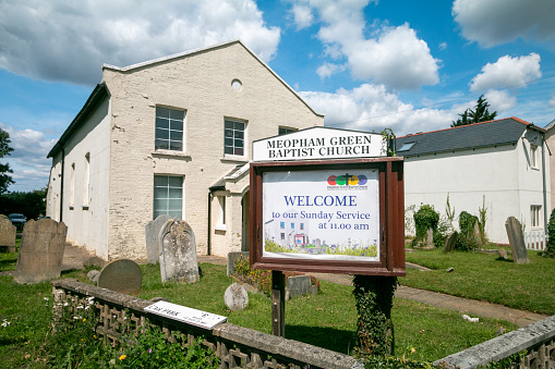 Welcome Sign at Meopham Green Baptist Church near Gravesend in Kent, England, with an illustration visible.