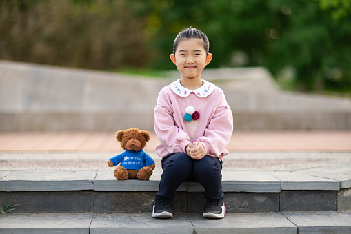 Cute Little Girl and Teddy Bear