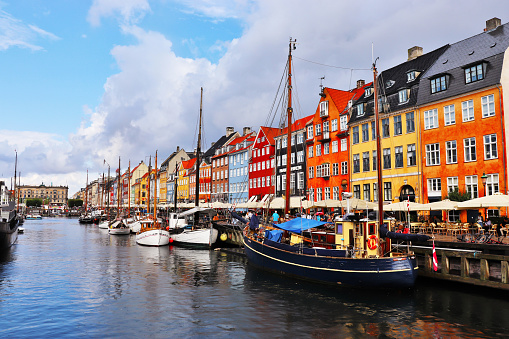 Nyhavn district in Copenhagen, Denmark. City center panoramic view of colorful houses.