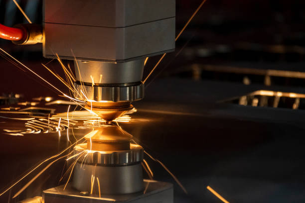 The fiber laser cutting machine cutting machine cut the metal plate. The fiber laser cutting machine cutting machine cut the metal plate. The hi-technology sheet metal manufacturing process by laser cutting machine. laser cutting metal stock pictures, royalty-free photos & images