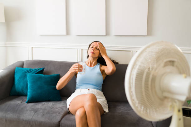 istock Sad woman trying to cool down 1391231324