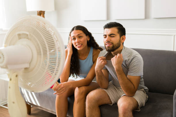 istock Hispanic couple feeling very hot 1391232545