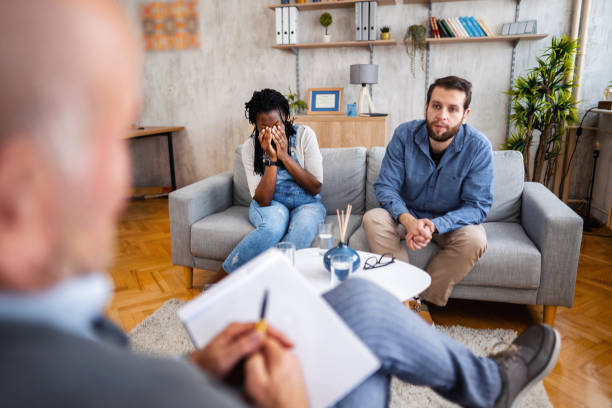 istock Married couple talking about their relationship with male psychologist 1391232800