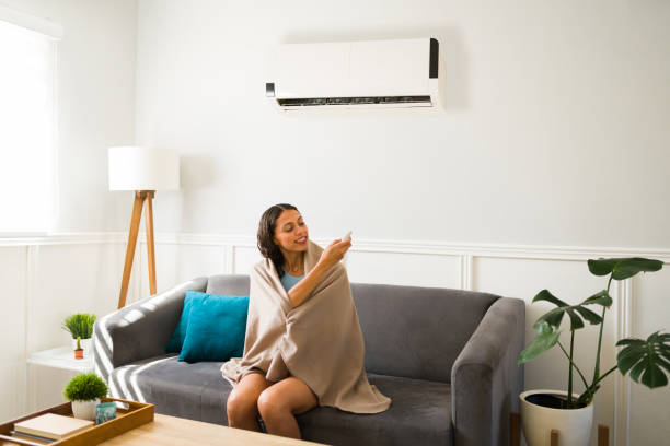 istock Enjoying the cold air flow of the ac unit 1391232995