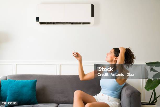 Suffering Because Of A Broken Air Conditioner Stock Photo - Download Image Now - Air Conditioner, Broken, Heat - Temperature