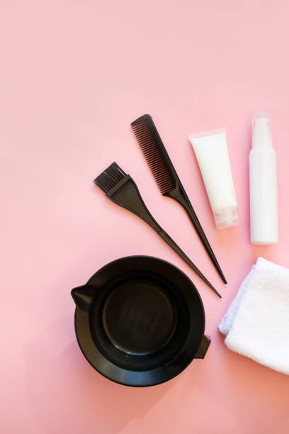 istock hairdresser tools on pink background. copy space. top view 1391233895