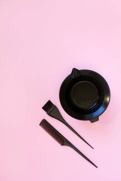 istock hairdresser tools on pink background. copy space. top view 1391233929