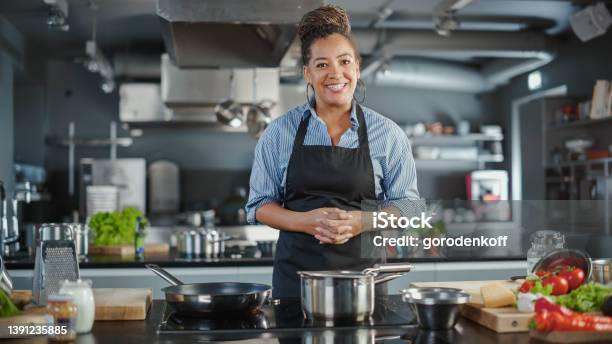 Tv Cooking Show In Restaurant Kitchen Portrait Of Black Female Chef Talks Teaches How To Cook Food Online Courses Streaming Service Learning Video Lectures Healthy Dish Recipe Preparation Stock Photo - Download Image Now