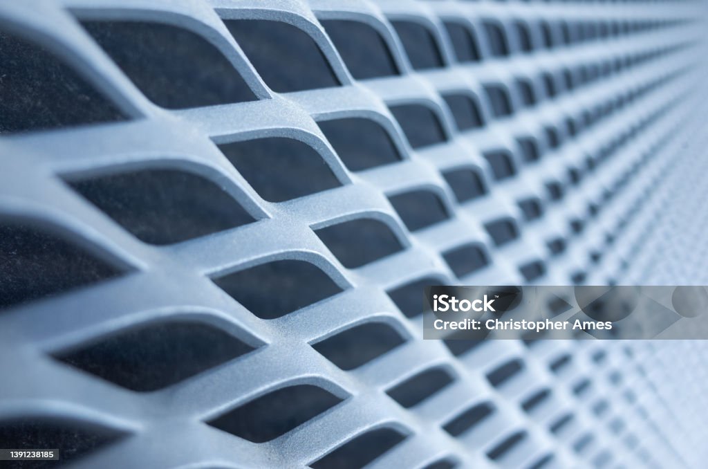 Expanded Aluminium Metal Sheet Grill Background Perspective shot of powder coated expanded aluminium metal protection grill. Metal Stock Photo