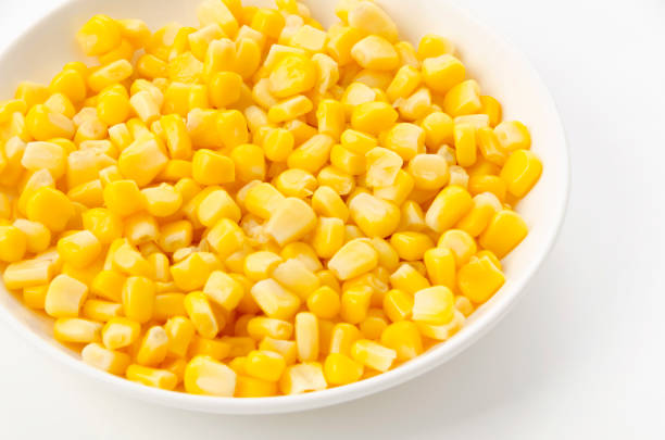 istock Canned sweet corn on a white plate on white background 1391238640