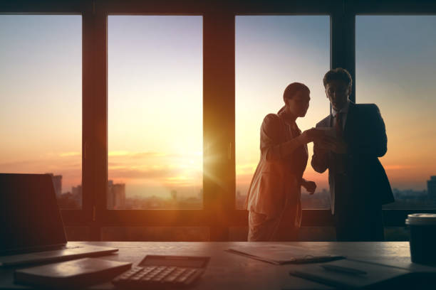 istock Man and woman are working in office 1391239409