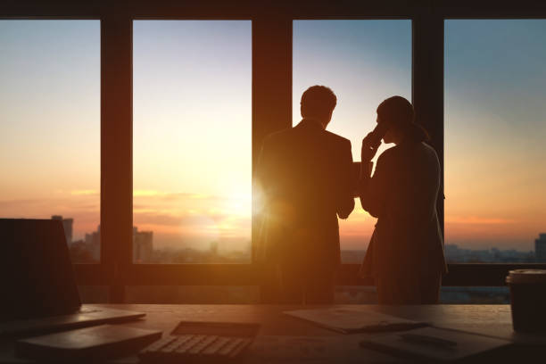 istock Man and woman are working in office 1391239410