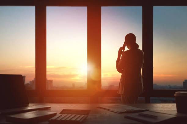 istock Woman is talking on phone in office 1391239413