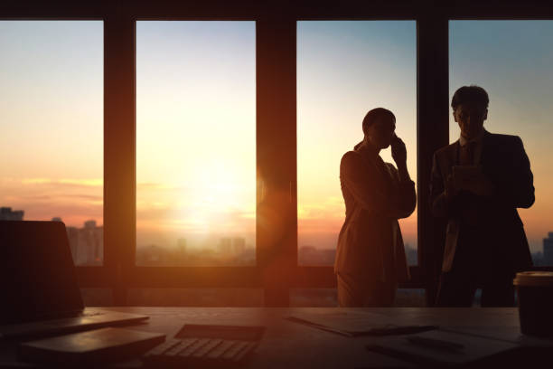 istock Man and woman are working in office 1391239415