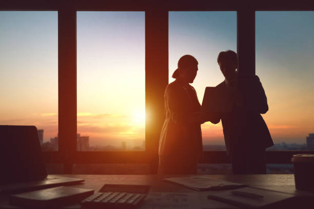 istock Man and woman are working in office 1391239426
