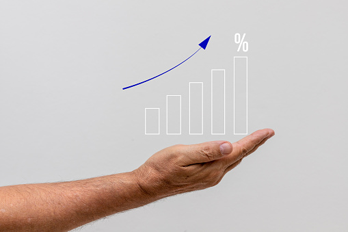 progressive increase graph over outstretched hand