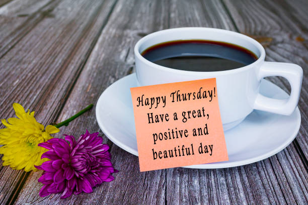 istock Motivational quote written on sticky note with white coffee cup and flowers. 1391240048