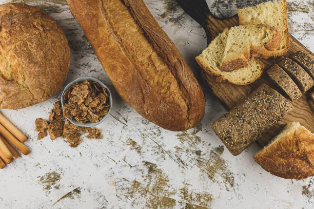 istock Breads assortment background. Baker shop context with delicious bread. Pastry items. 1391242498