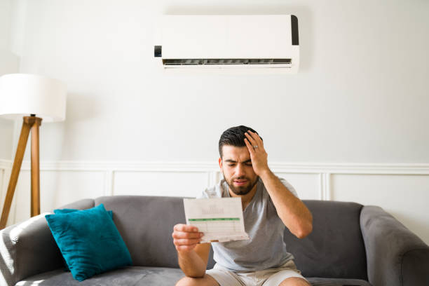 istock Worried man looking at his bills 1391242541