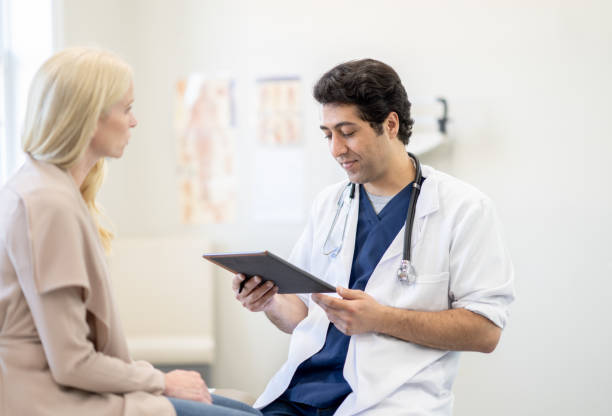 istock Doctor Talking with a Patient 1391245148