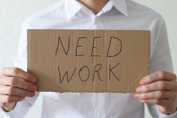 istock Businessman Holding Need Work Sign 1391246938
