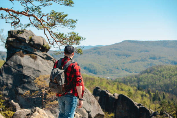 istock man hiker with backpack at dovbush rocks 1391247037