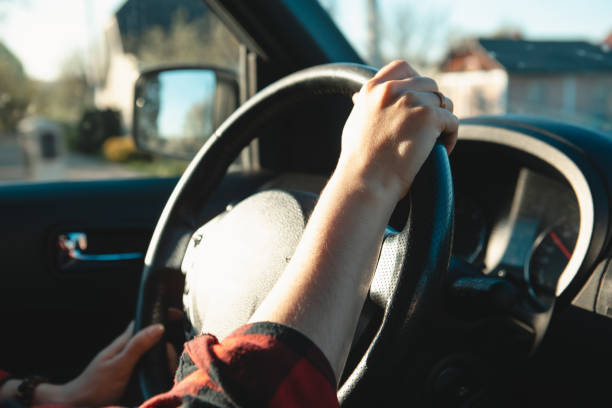 istock woman hands on steering wheel 1391247038