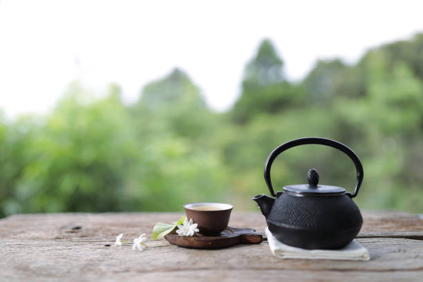 istock Black vintage teapot and cup at outdoor 1391248048