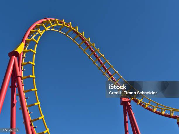 Closeup View Of The Red And Yellow Colored Rails Of A Roller Coaster In Amusement Park Wurstelprater In Vienna Austria On Sunny Day In Spring Viewed From Public Ground Stock Photo - Download Image Now